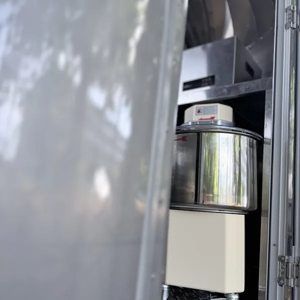 The dough mixer inside the Airstream, seen through the open door